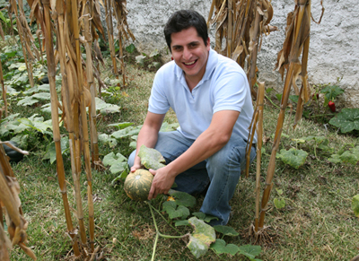 Luis Sacayon in the garden with Ayote, FLAAR Mesoamerica Staff