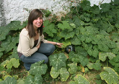 Ximena Jop with Ayote in the garden, FLAAR Mesoamerica Staff