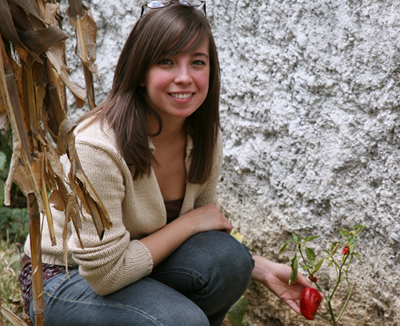 Ximena Jop with the Chile Pimiento in the garden, FLAAR Mesoamerica Staff