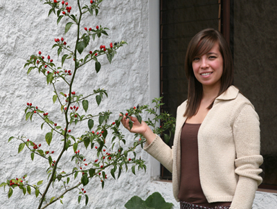 Ximena Jop with Chile in the garden, FLAAR Mesoamerica Staff