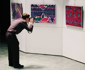 Nicholas Hellmuth taken pictures from exhibition