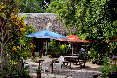 Outdoor tables of the Hotel Jaguar Inn Tikal