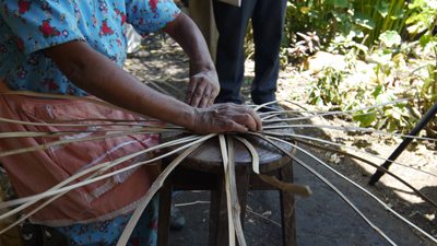 Woman hand made baskets process model venas varas market stalls San Rafael Chilasco Guatemala Central America